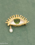 Whimsical 18K Gold Eye Brooch with Peridot, Diamonds & Pearl Teardrop